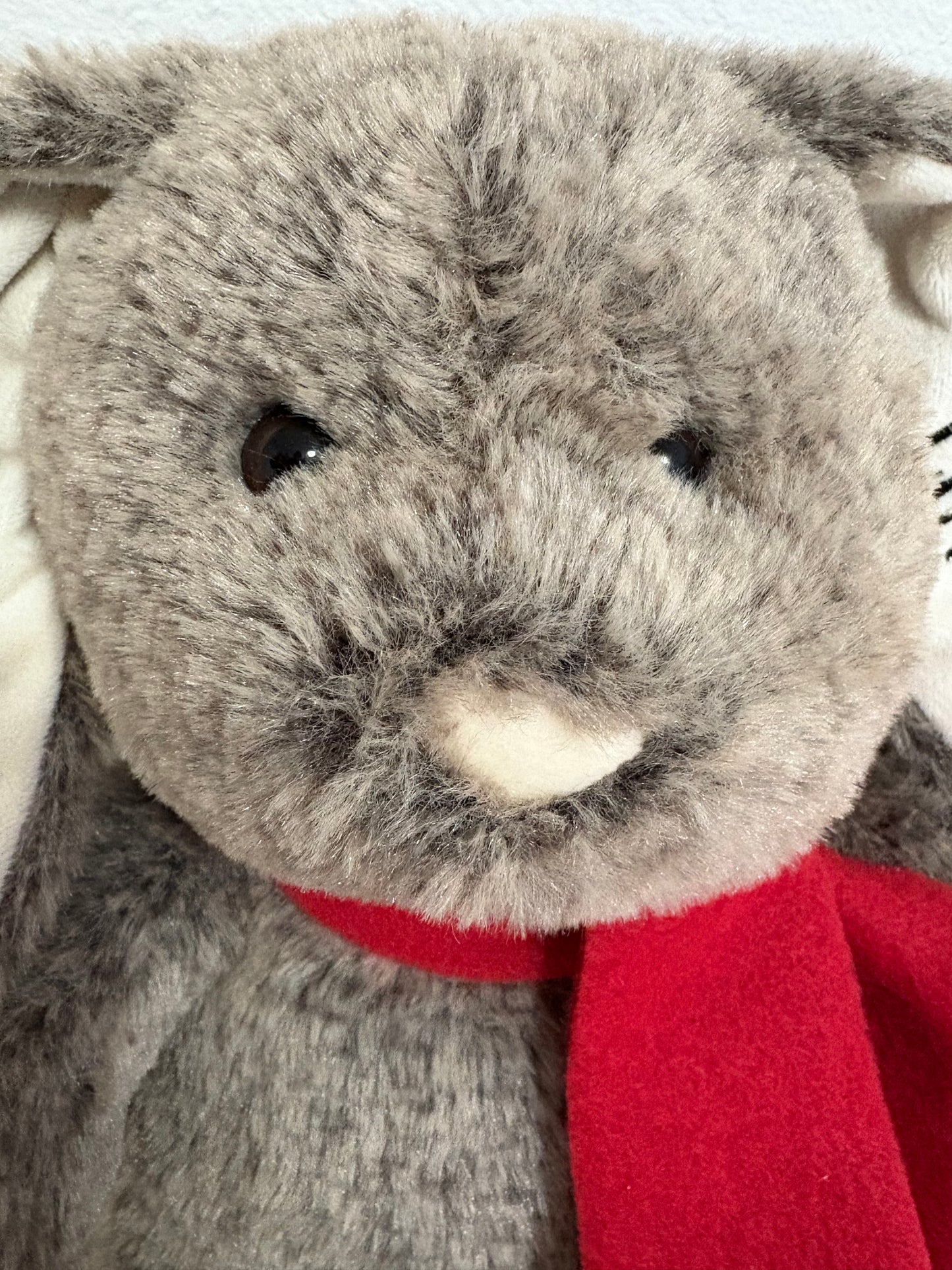 Close-up of a plush bunny with a red scarf