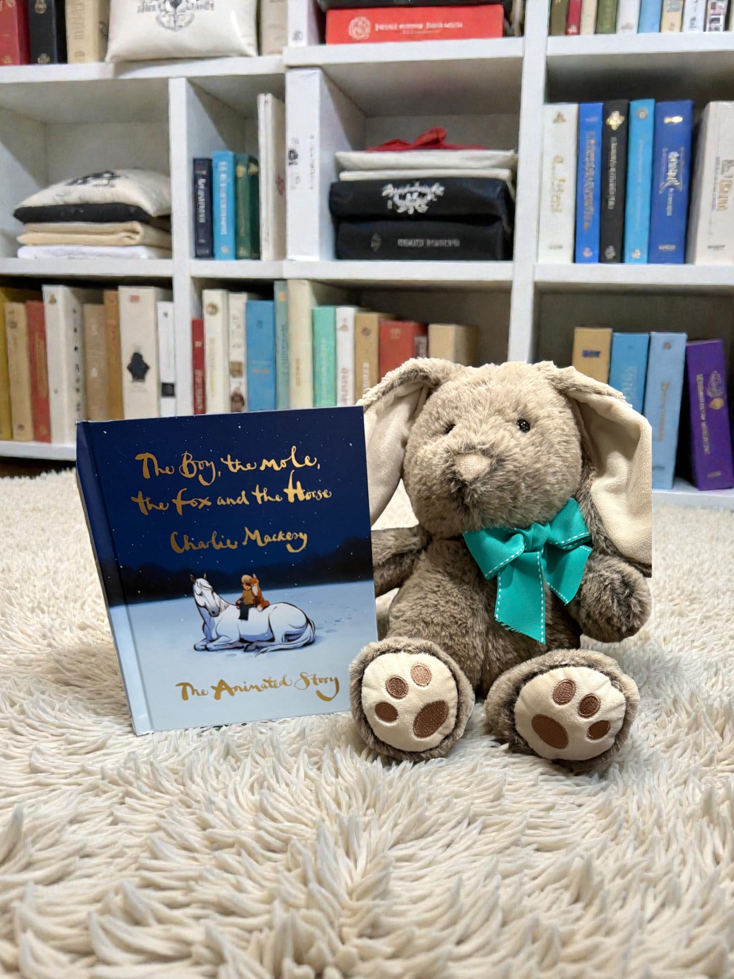 14 inch personalized bunny plush shown next to book for size reference