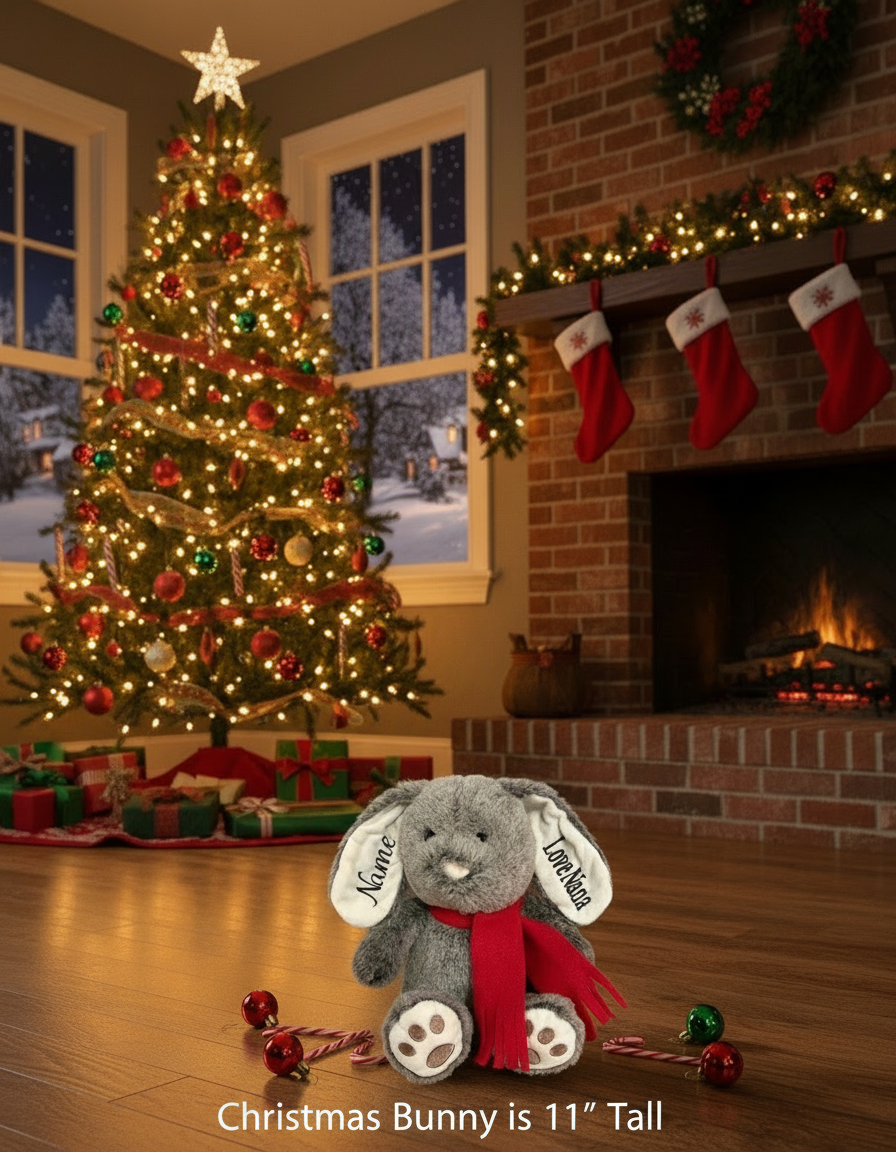 Plush rabbit toy with a red scarf on a wooden surface